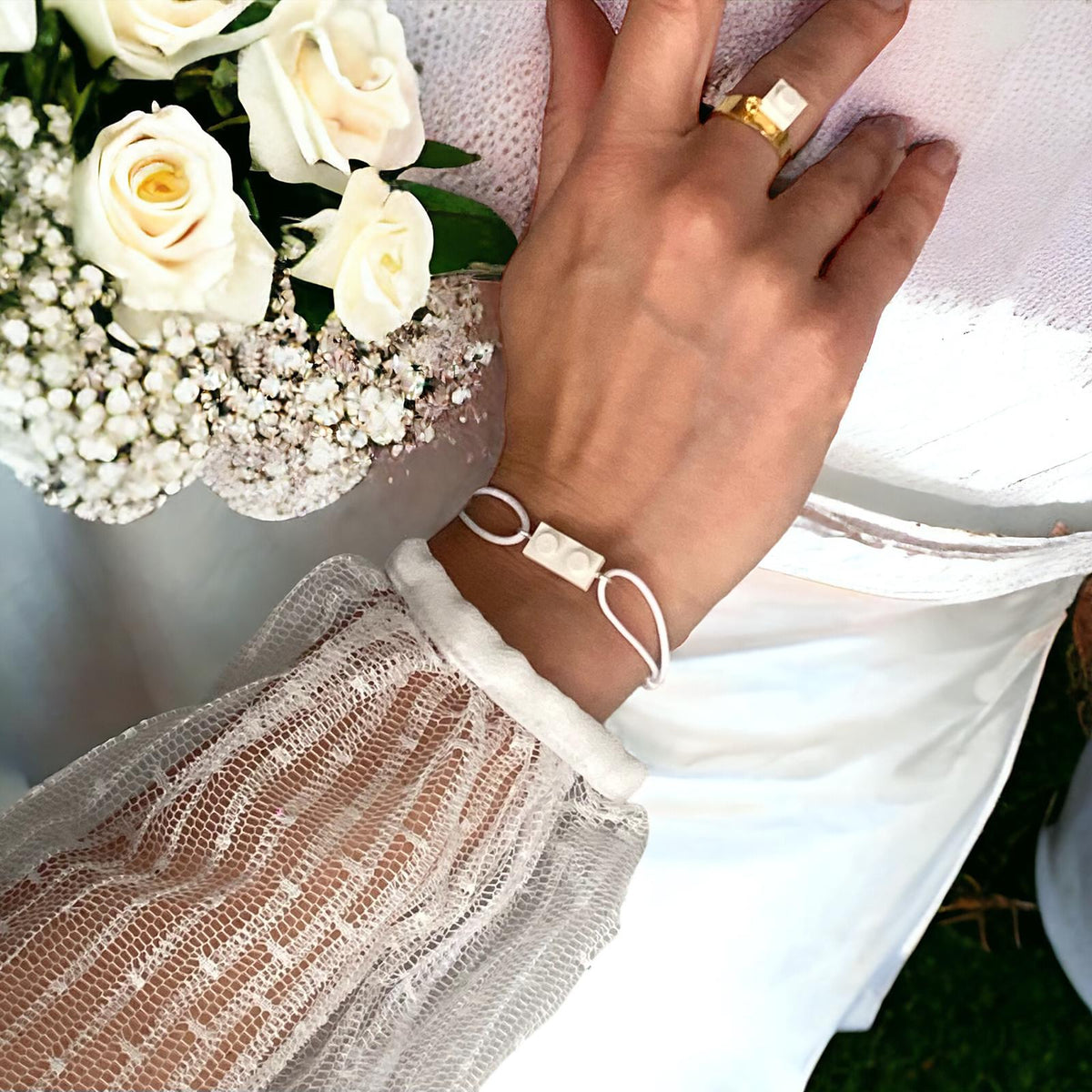 Parure bracelet et bague Brique d'Oreille pour un mariage sur le thème Lego
