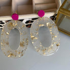 Boucles d'oreille paillettes or et Lego en acétate blanc avec pastille Lego rose.